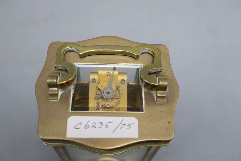 A brass carriage timepiece, height 13cm (handle down)